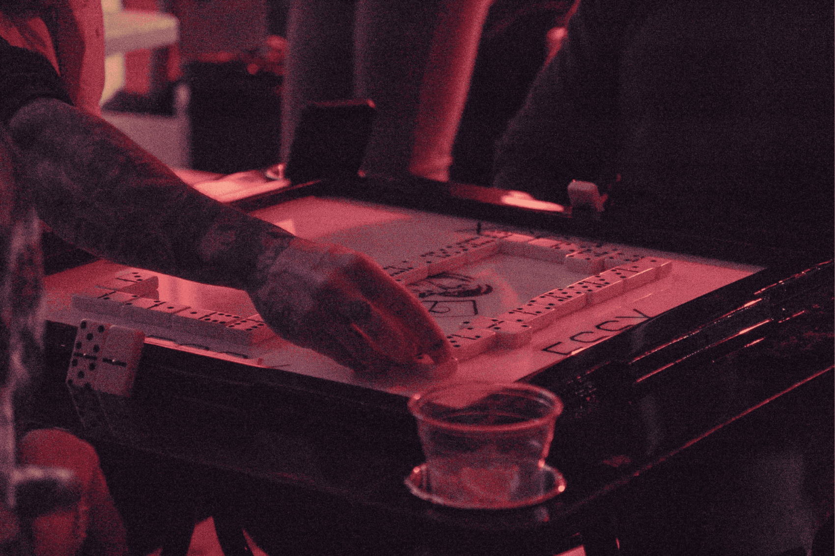 Bartender pouring a drink at a bar.