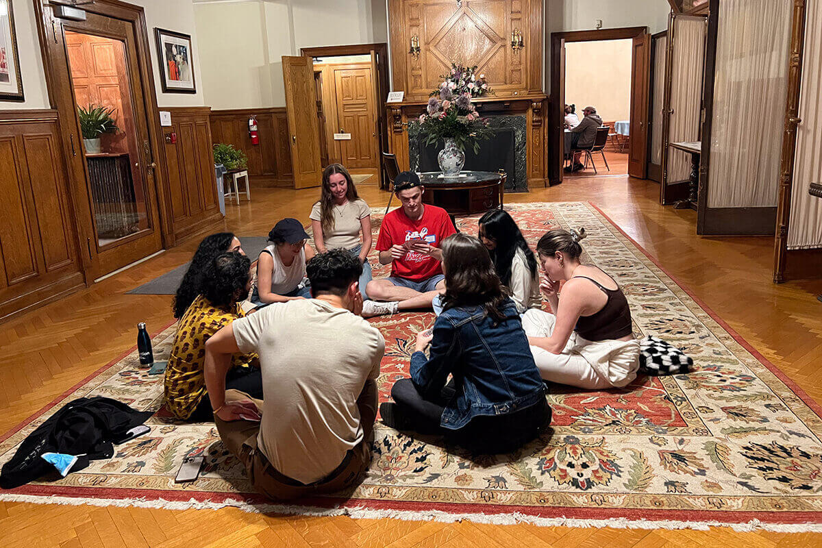 Group of people engaging in conversation at a gathering.