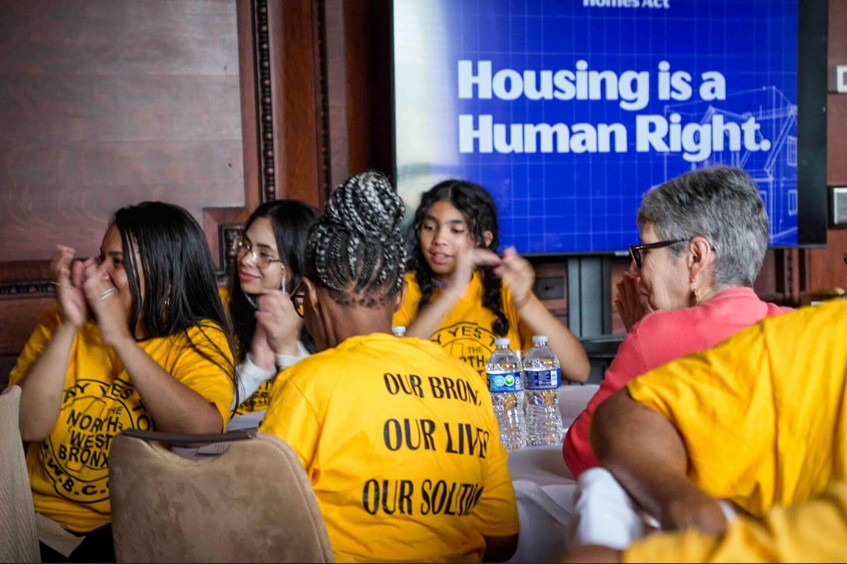 Person speaking at a podium with the Library of Congress seal, microphone in front.