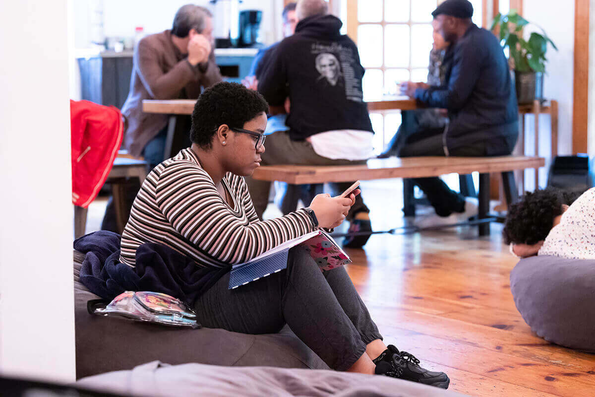 Two young people engaged in a video recording session.