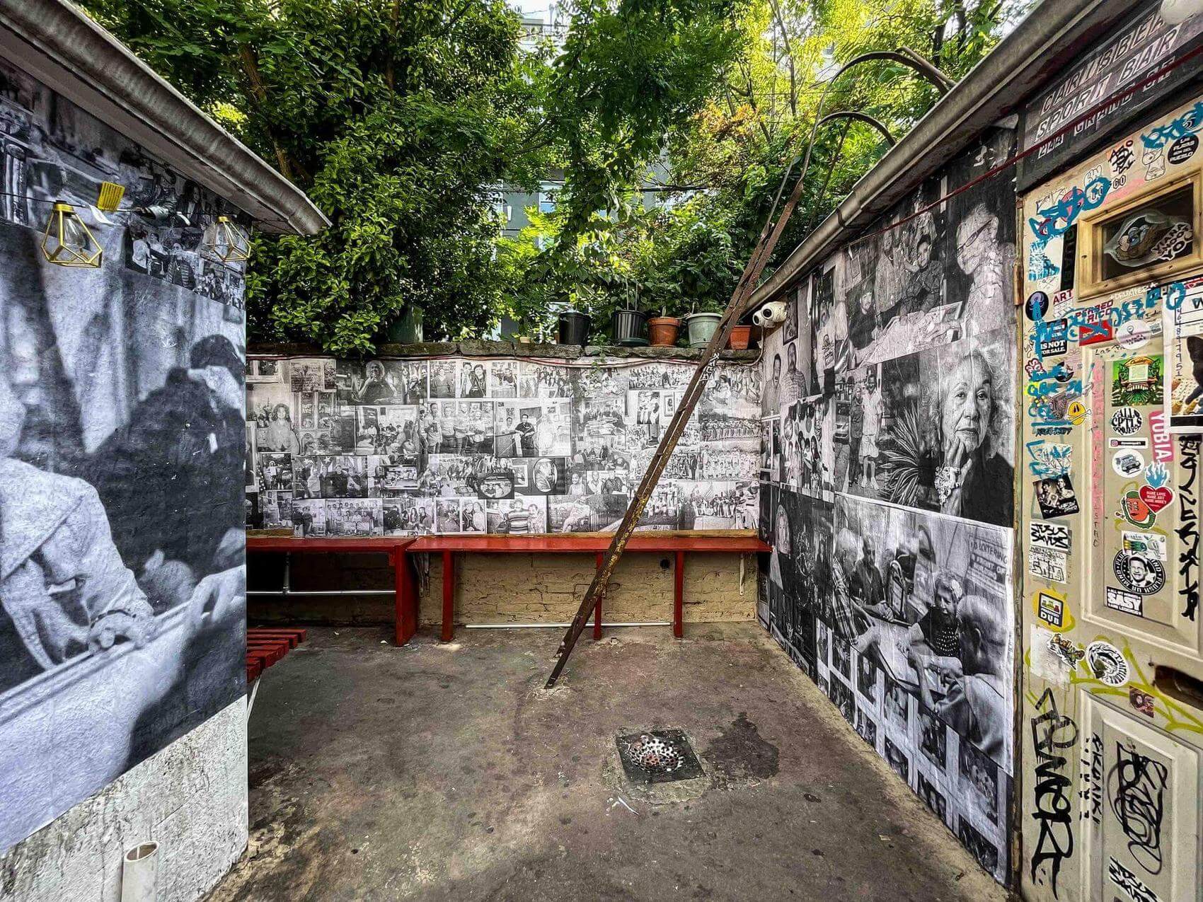 Black and white photo mural featuring a family with a trophy.