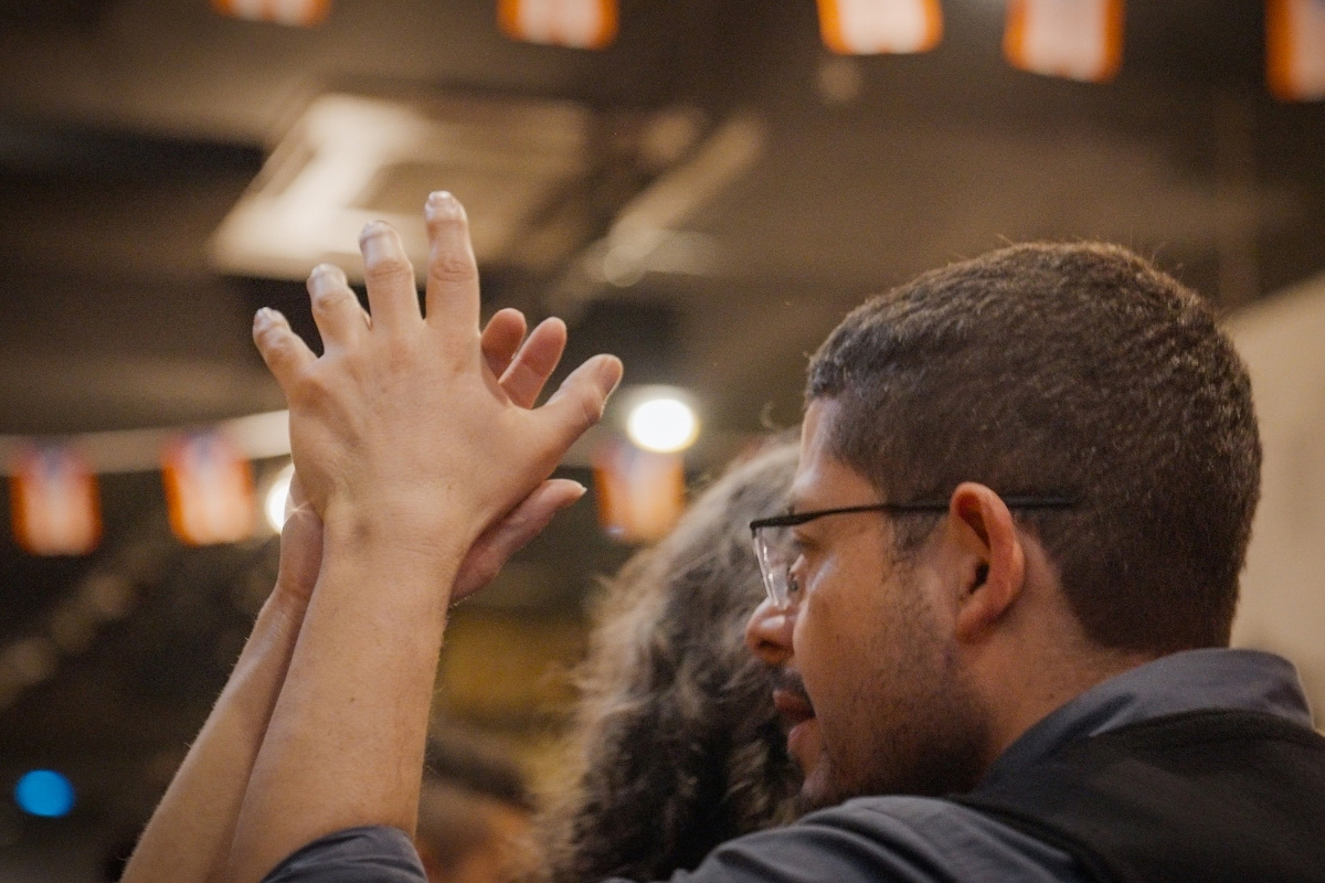 Community members dancing salsa and sharing poetry during the SALSACTIVISM event in Sunnyside, Queens.