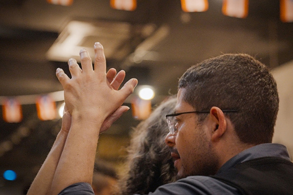 Community members dancing salsa and sharing poetry during the SALSACTIVISM event in Sunnyside, Queens.