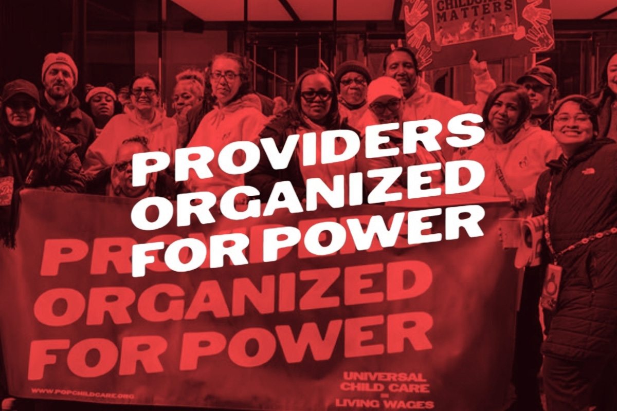 Childcare providers and community members holding a “Providers Organized for Power” banner advocating for universal childcare and living wages.