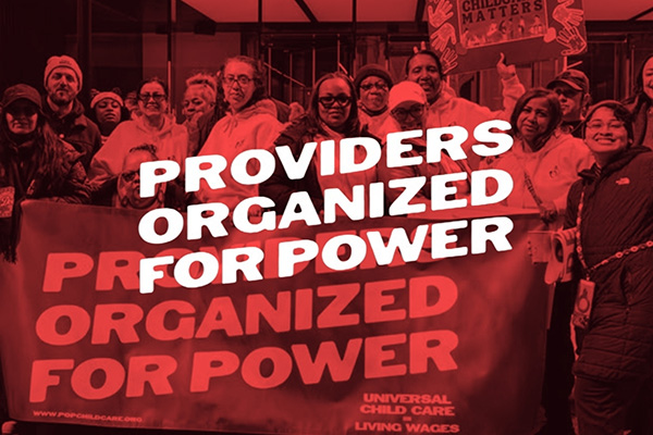Childcare providers and community members holding a “Providers Organized for Power” banner advocating for universal childcare and living wages.