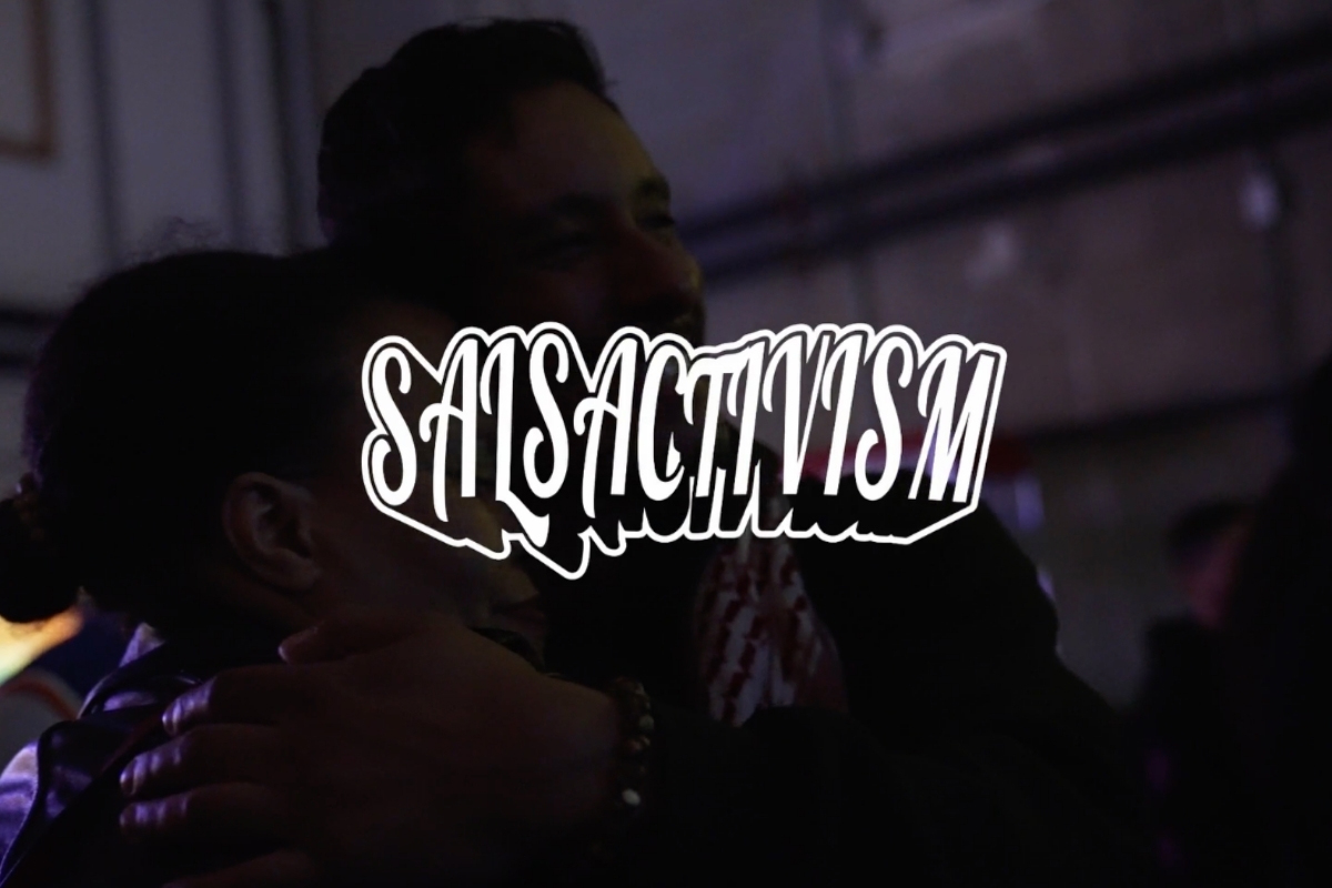 People embracing and celebrating during SALSACTIVISM, a Puerto Rican community gathering featuring poetry, cultural resistance, salsa music, dancing, and live performances in New York City.