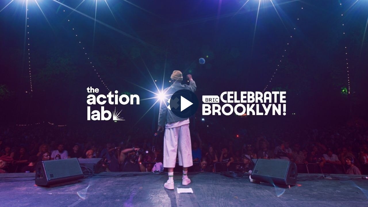 Common performing at BRIC Celebrate Brooklyn!, with The Action Lab and BRIC logos.