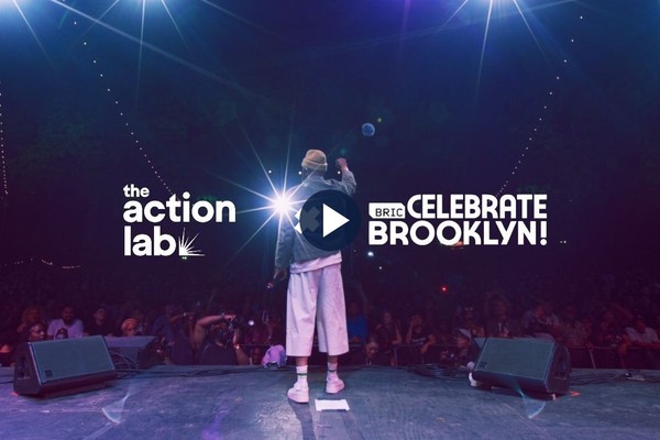 Common performing at BRIC Celebrate Brooklyn!, with The Action Lab and BRIC logos.