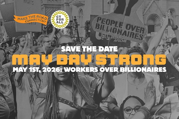 Crowd of workers and organizers holding signs reading “People Over Billionaires” during a May Day mobilization.