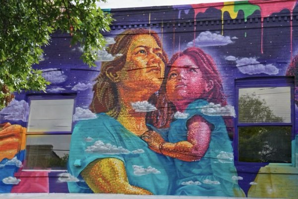 Dasic Fernández’s colorful mural at CUFFH’s headquarters in Brooklyn.
