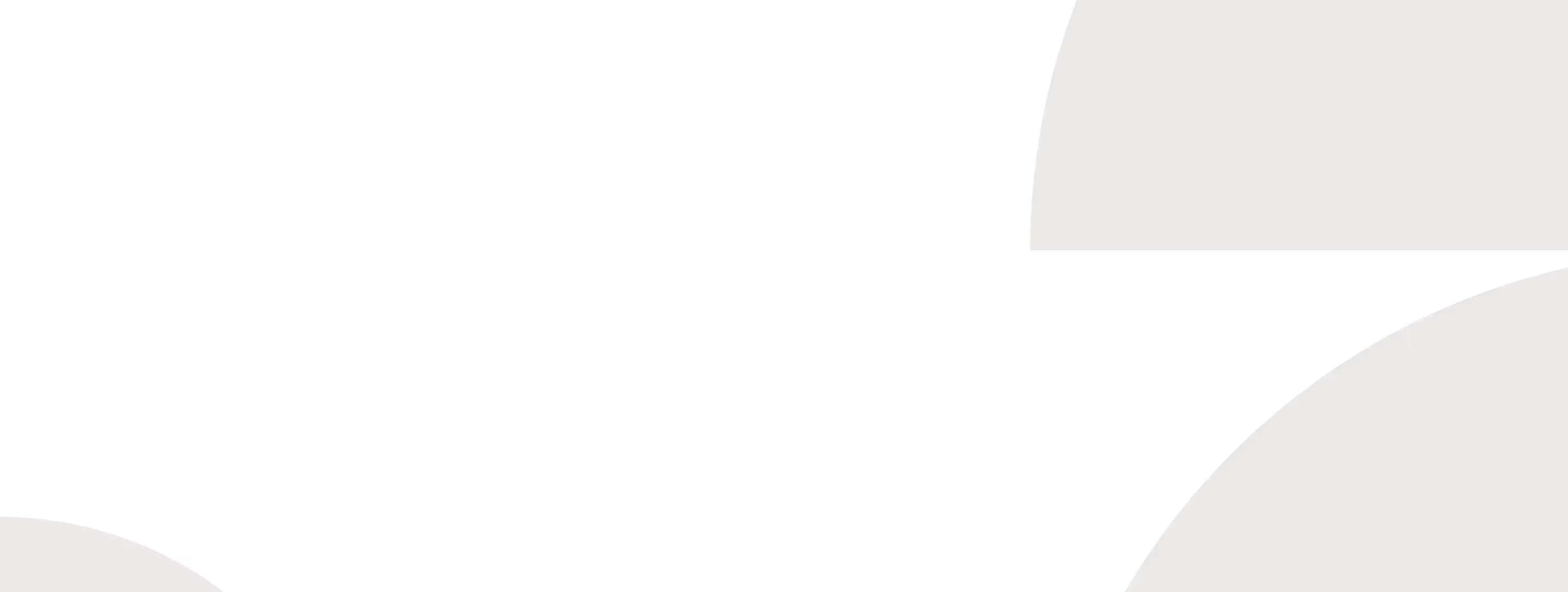 Close-up of a woman holding a paper and pen, writing notes in front of a laptop on a desk.