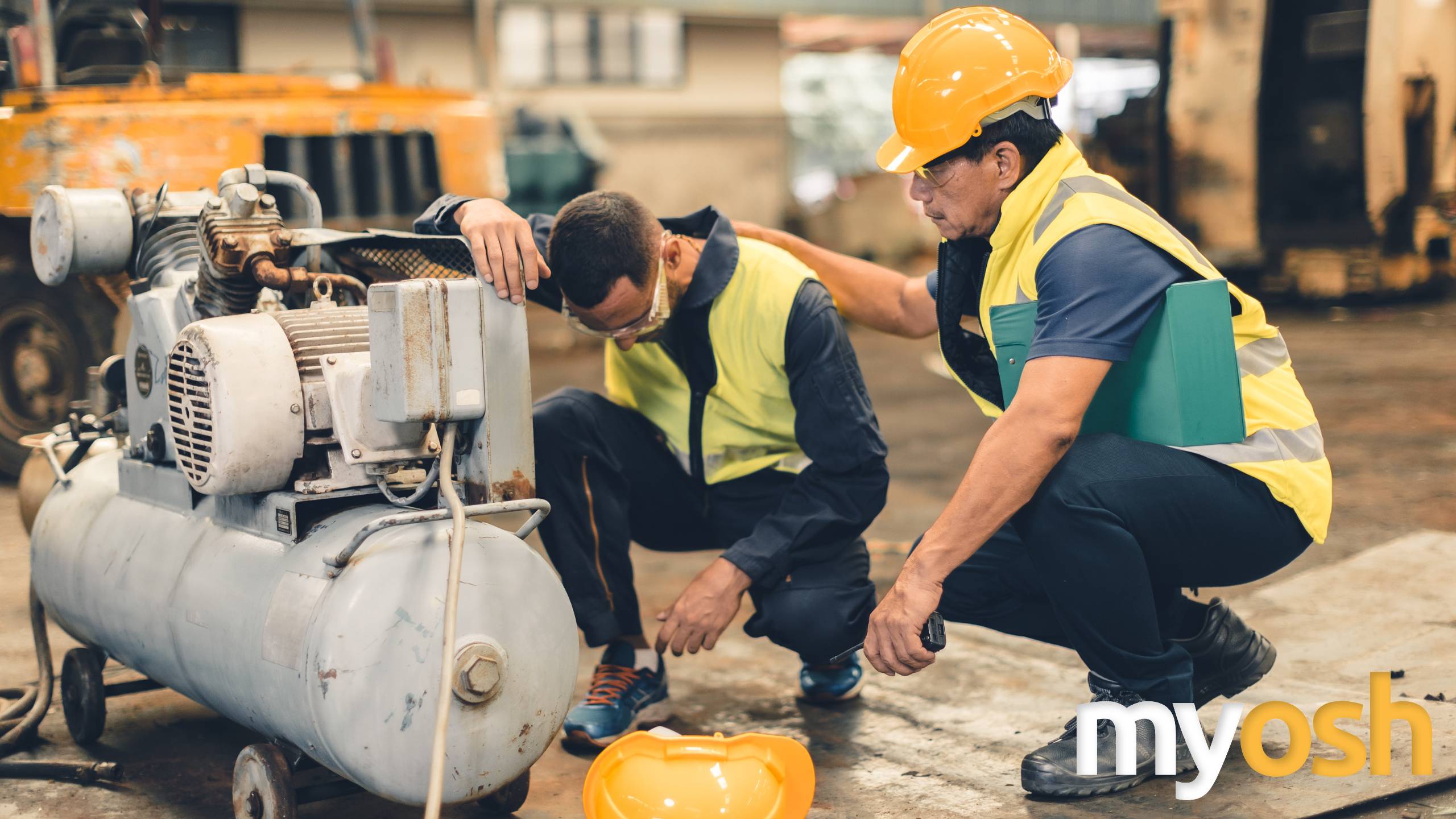 Workers in a mining or transport environment using digital safety tools to monitor fatigue and manage risk in high-risk operations.