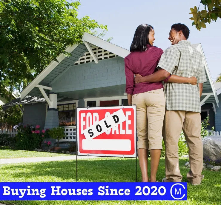happy homeowners looking at each other after selling their house to we buy houses cash home buyer