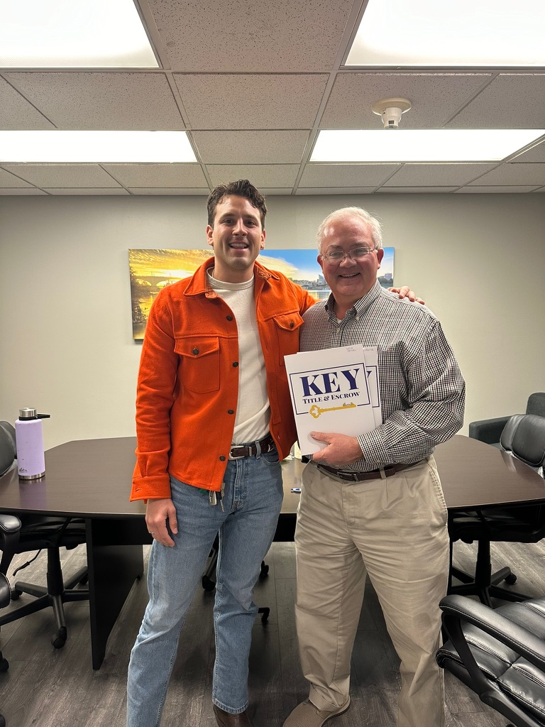 Andrew Manuel with sellers on closing day