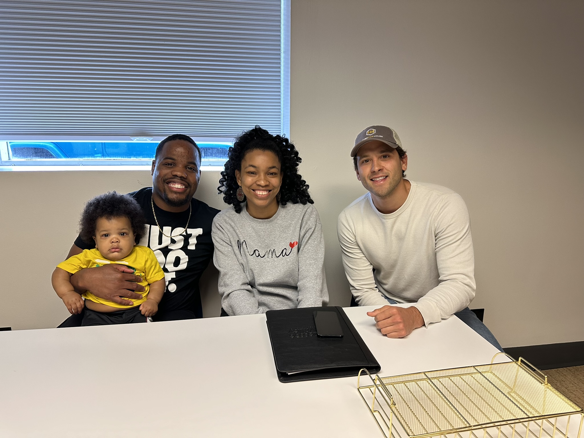 Andrew Manuel with a seller family at closing
