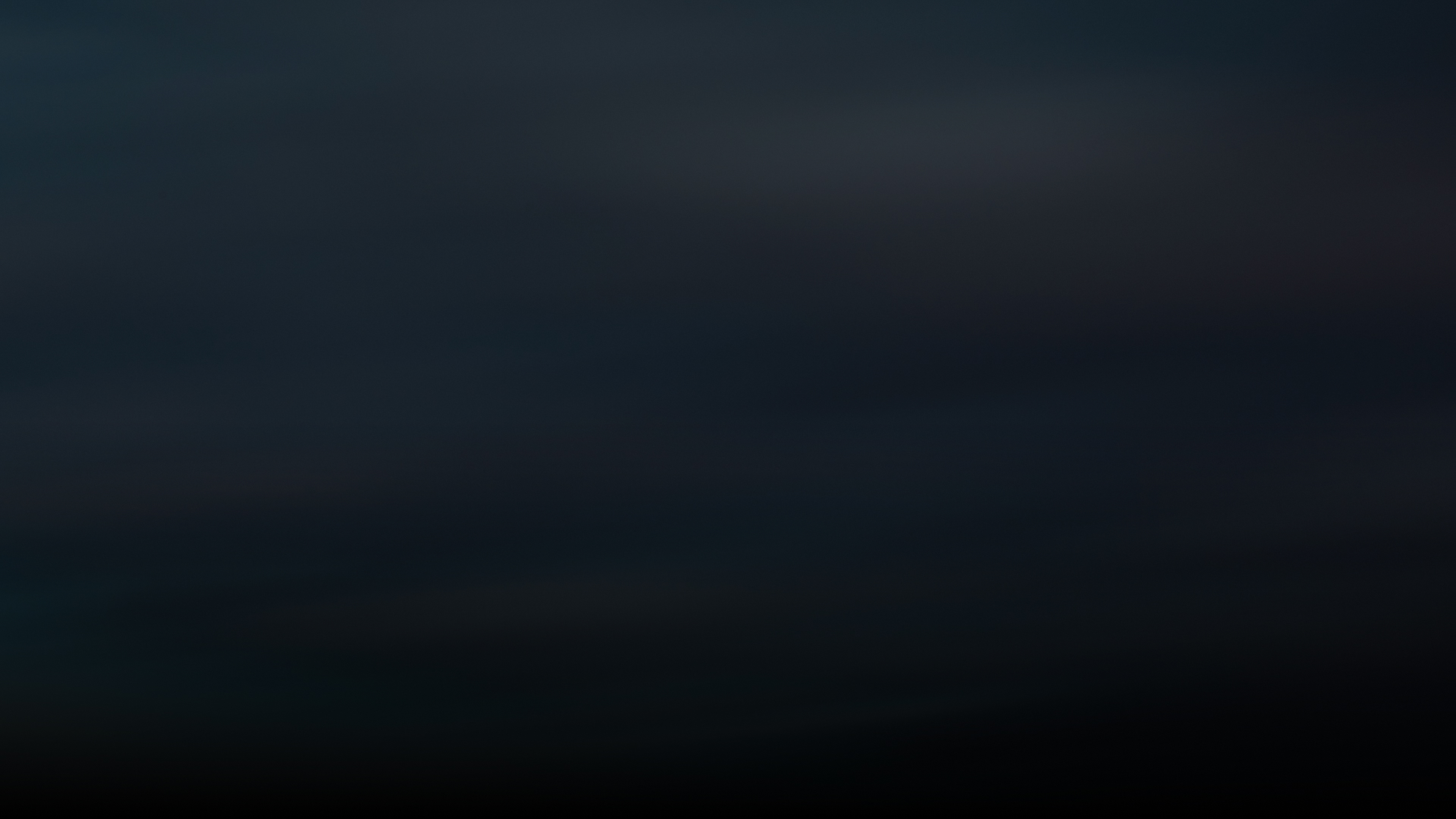 Dark gradient background with subtle shades of black and deep blue.