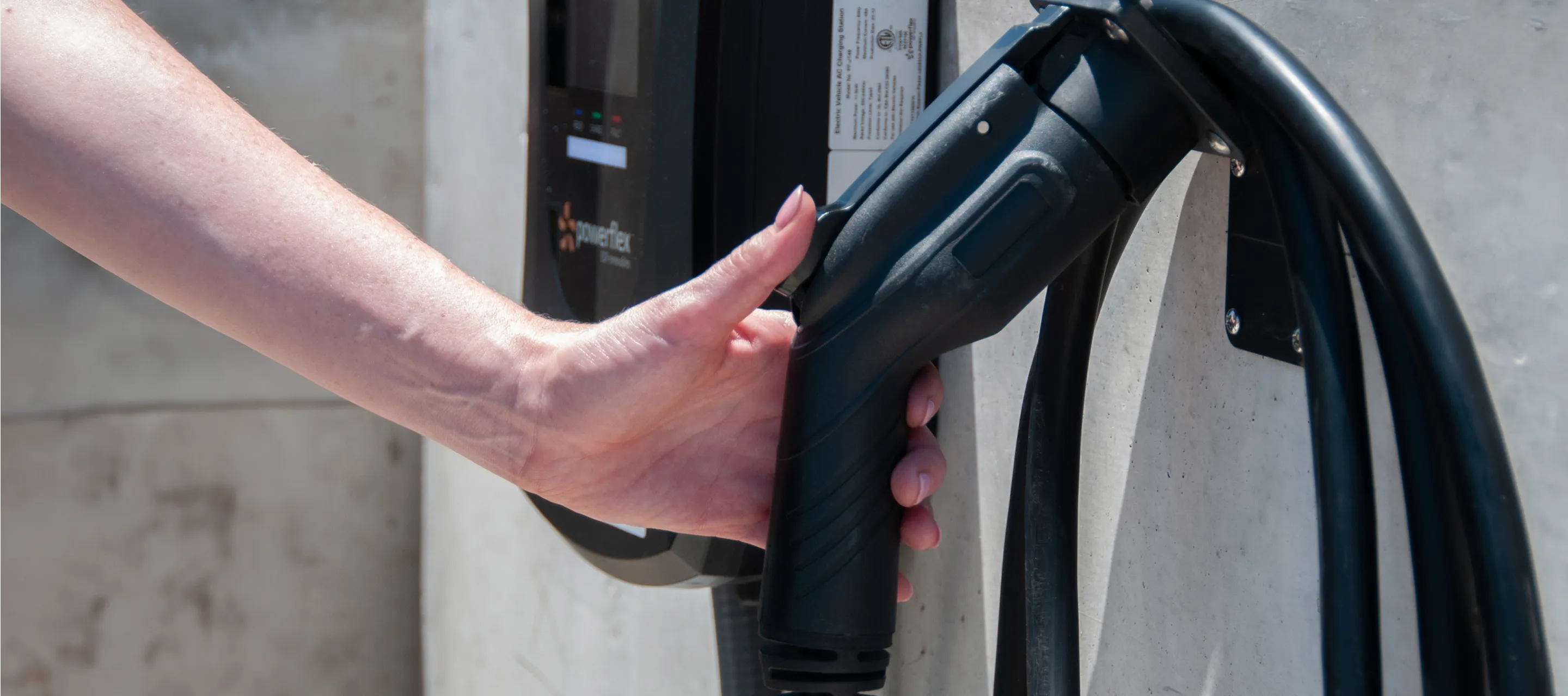 Close-up of an electric car charging.