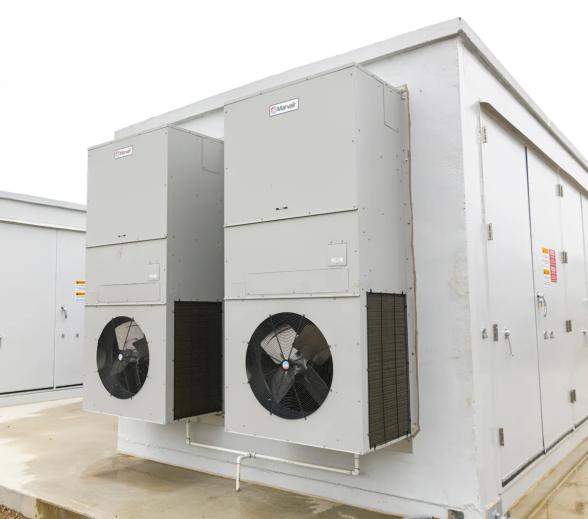 Large white outdoor battery energy storage unit.