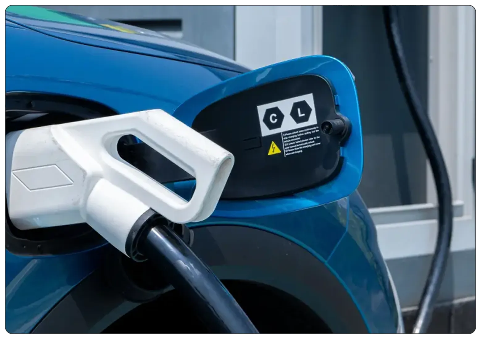 Close-up of an electric car charging.