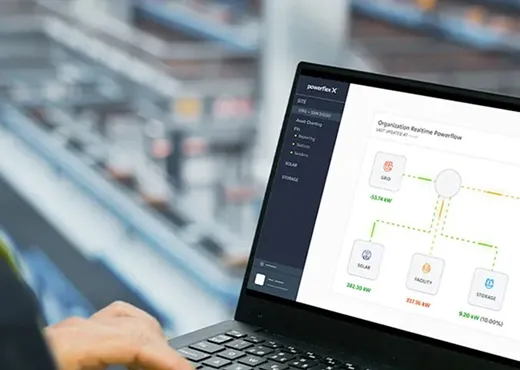 Person holding a laptop with PowerFlex X page opened