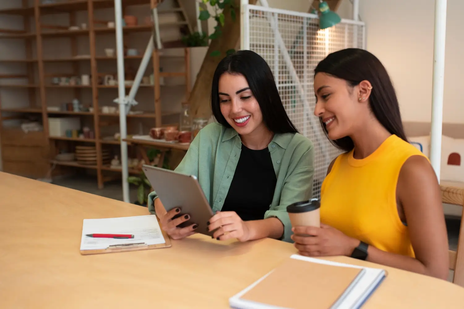 Two women working together