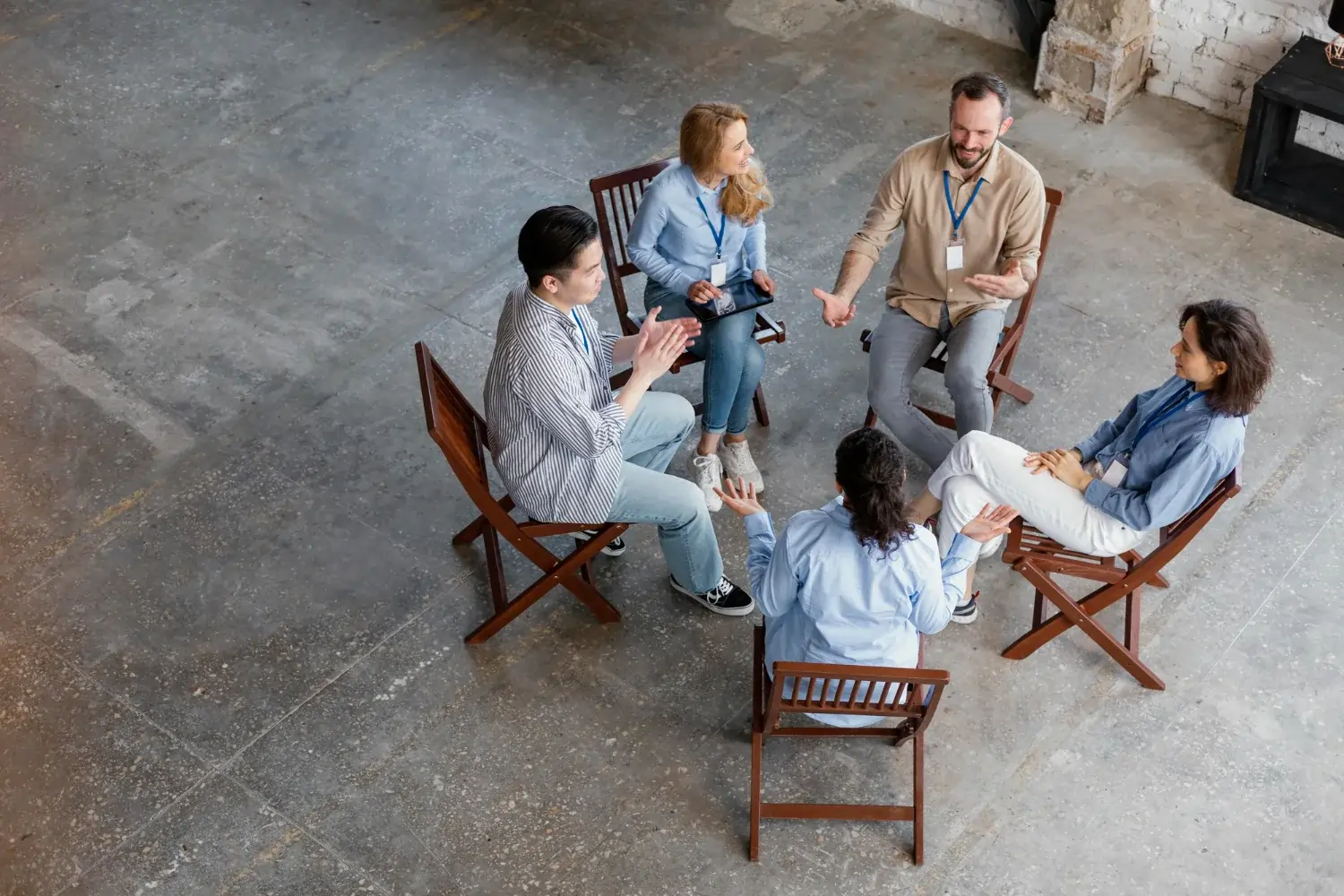 Team members discussing in a circle