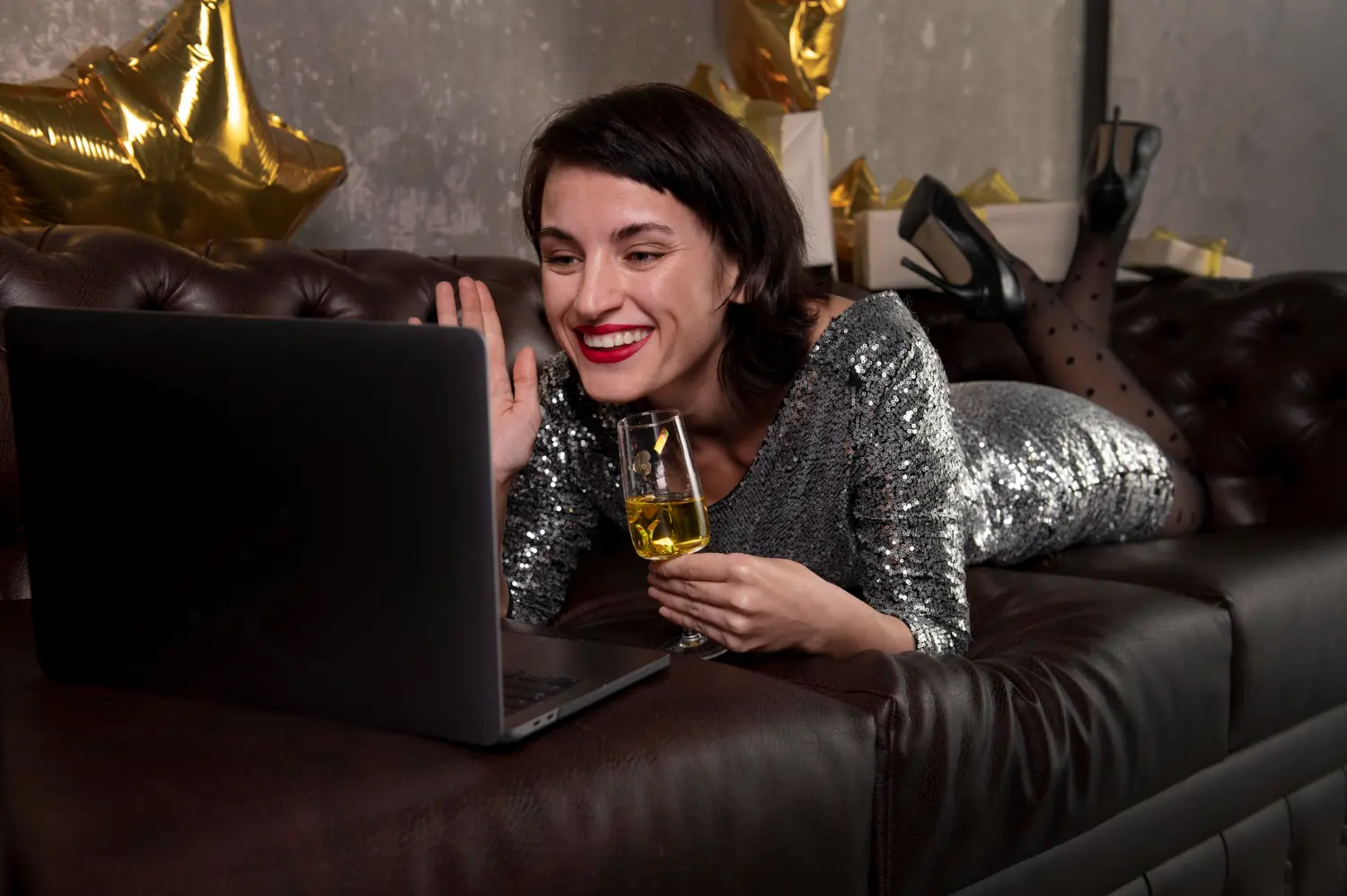 Dressed up lady in front of laptop