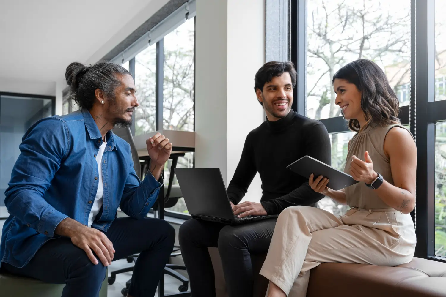 Three colleagues talking