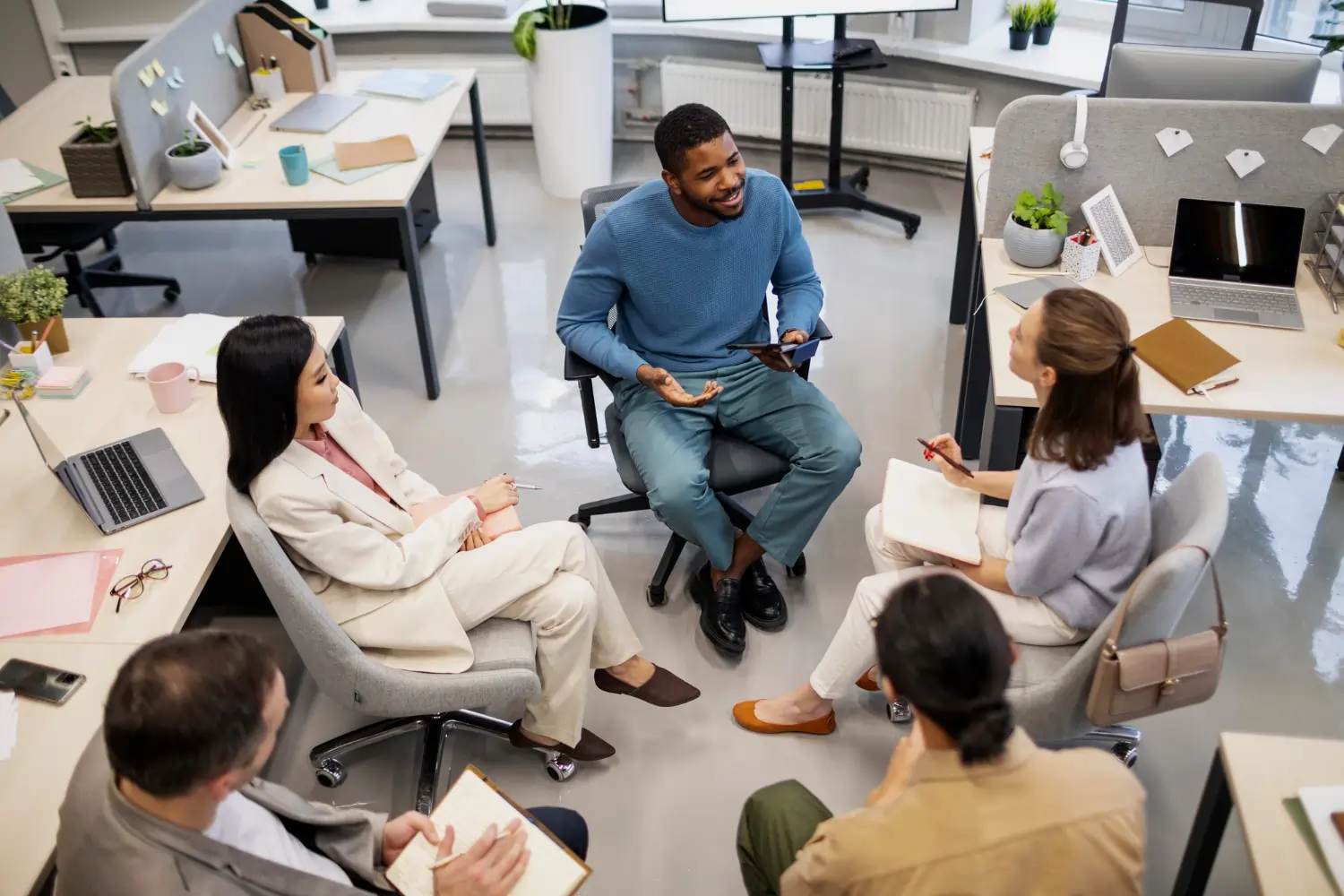 Diverse team brainstorming in office