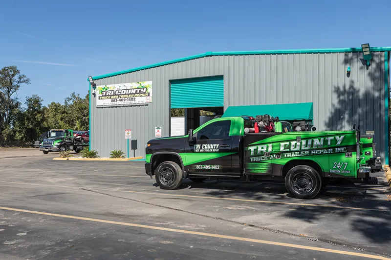 Roadside breakdown service truck outside Tri County Truck and Trailer Repair on the Polk Parkway.