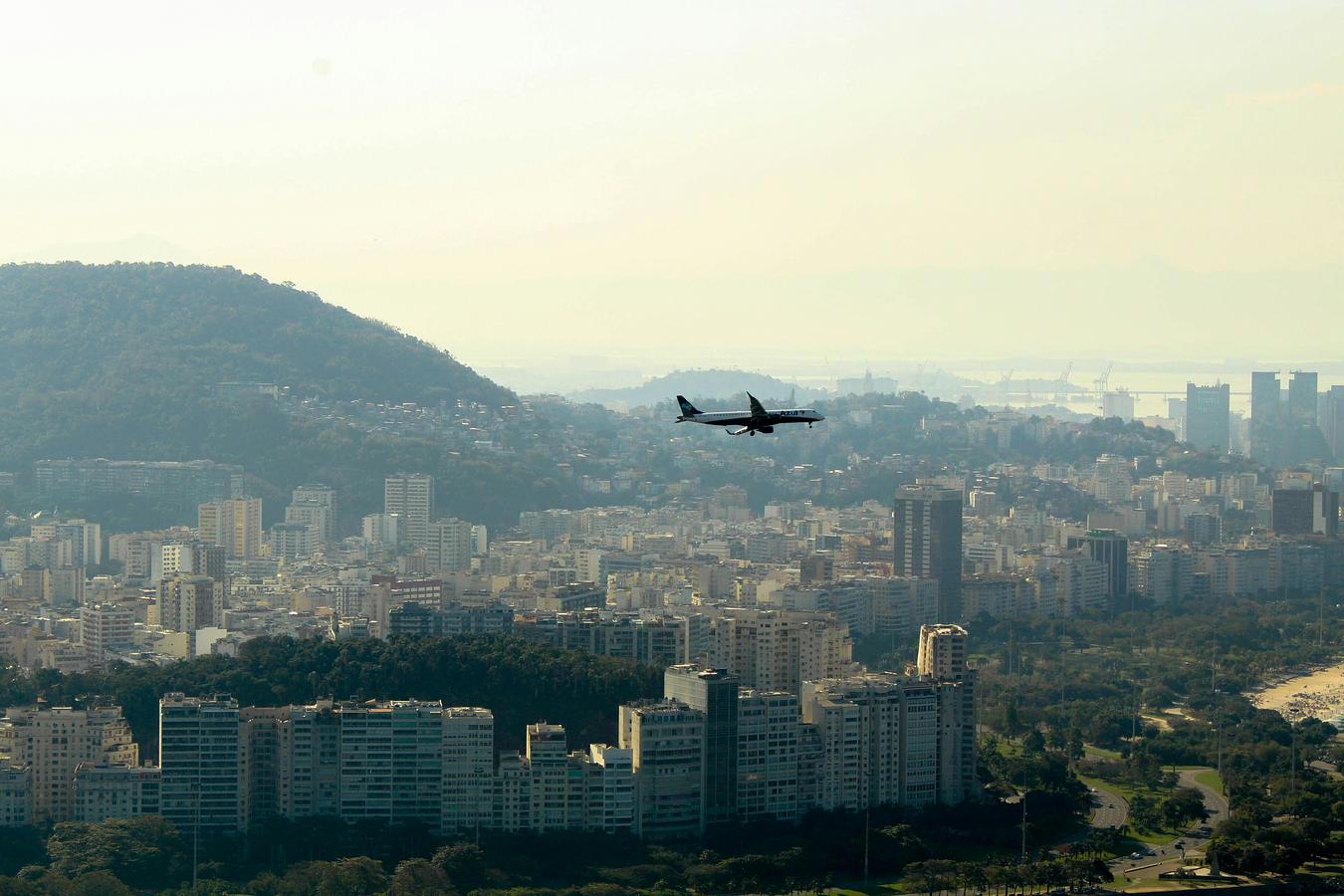 Air injection cargo plane flying over a city
