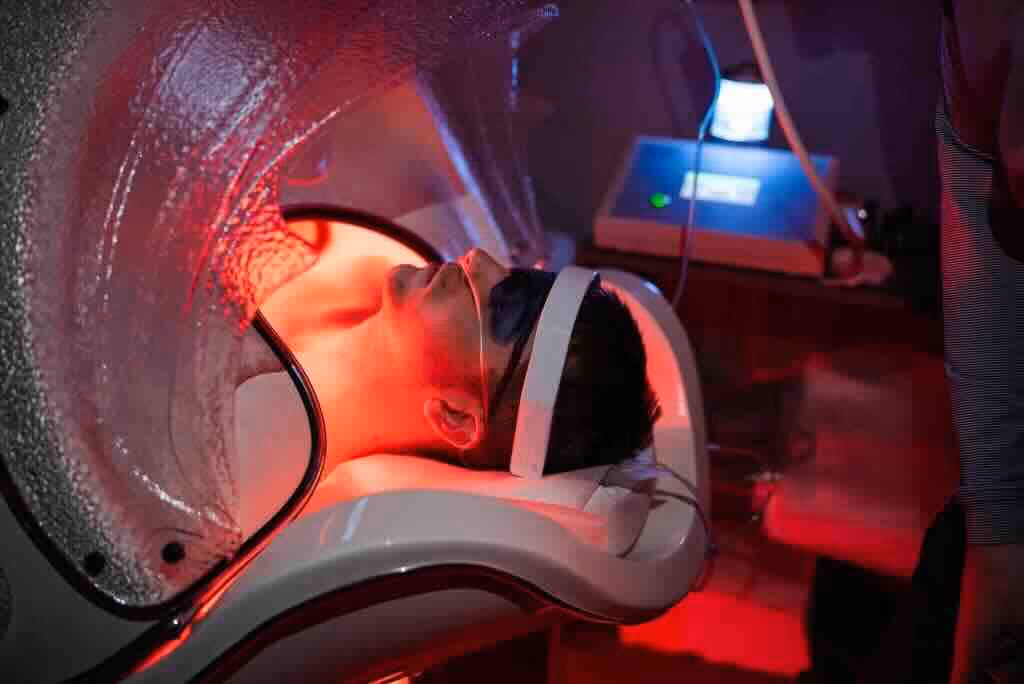 Patient receiving Red Light LED Panel Therapy at NeuroSolution Center of Lake Charles.