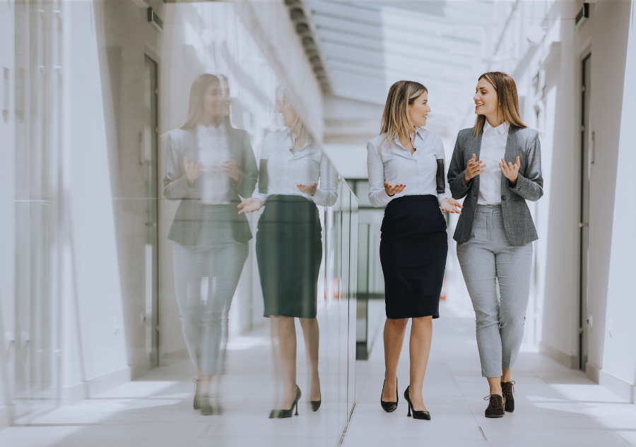 People talking as they walk. Work growth opportunities.