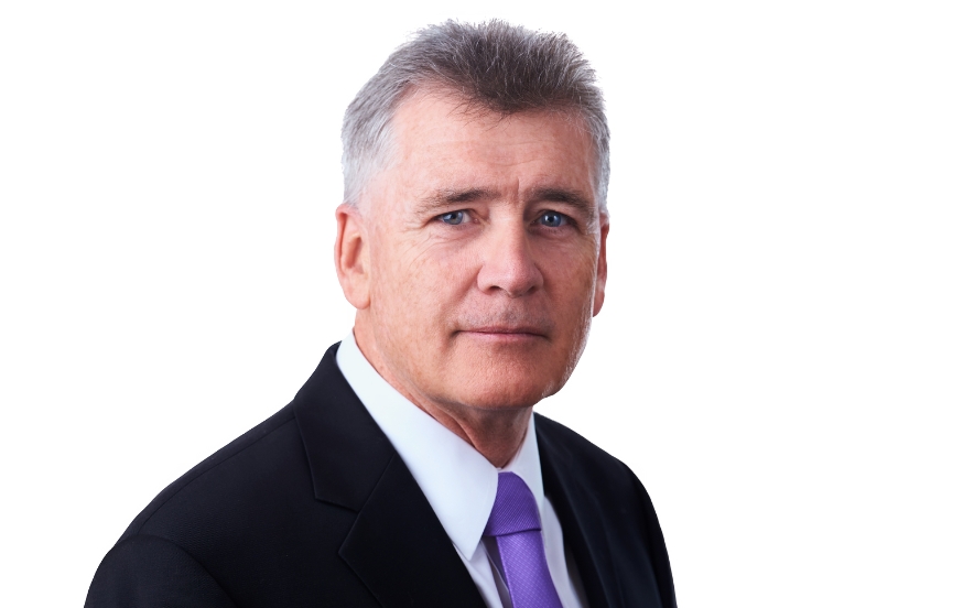 Headshot of James Varney, Partner at McVeagh Fleming, professional style photo against light background.