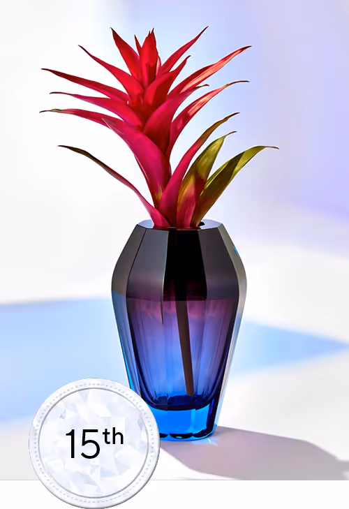 Blue Glass flower jar with pink plant