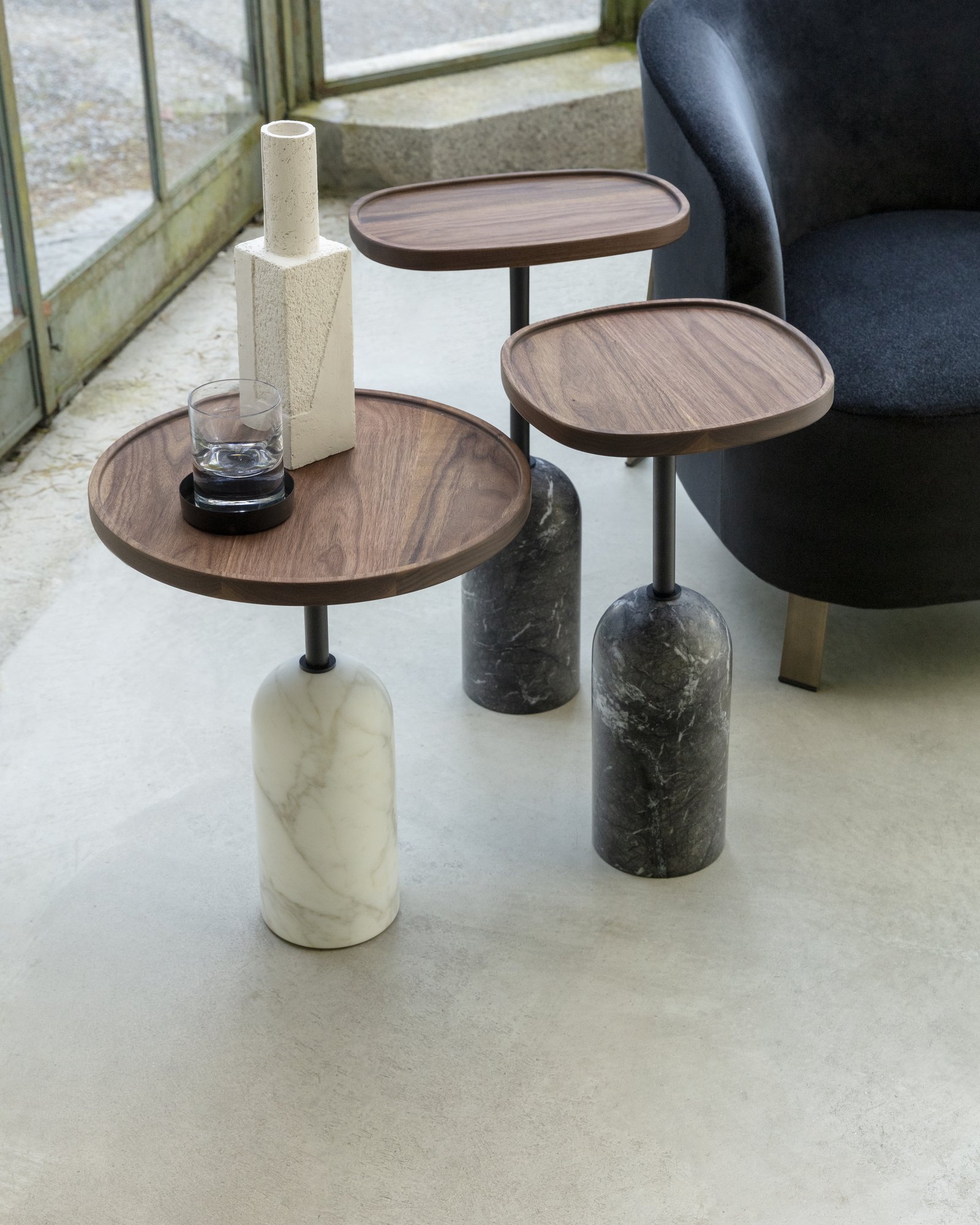 Ekero side tables by Tollgard & Castellani for Porada with walnut tops on marble bases