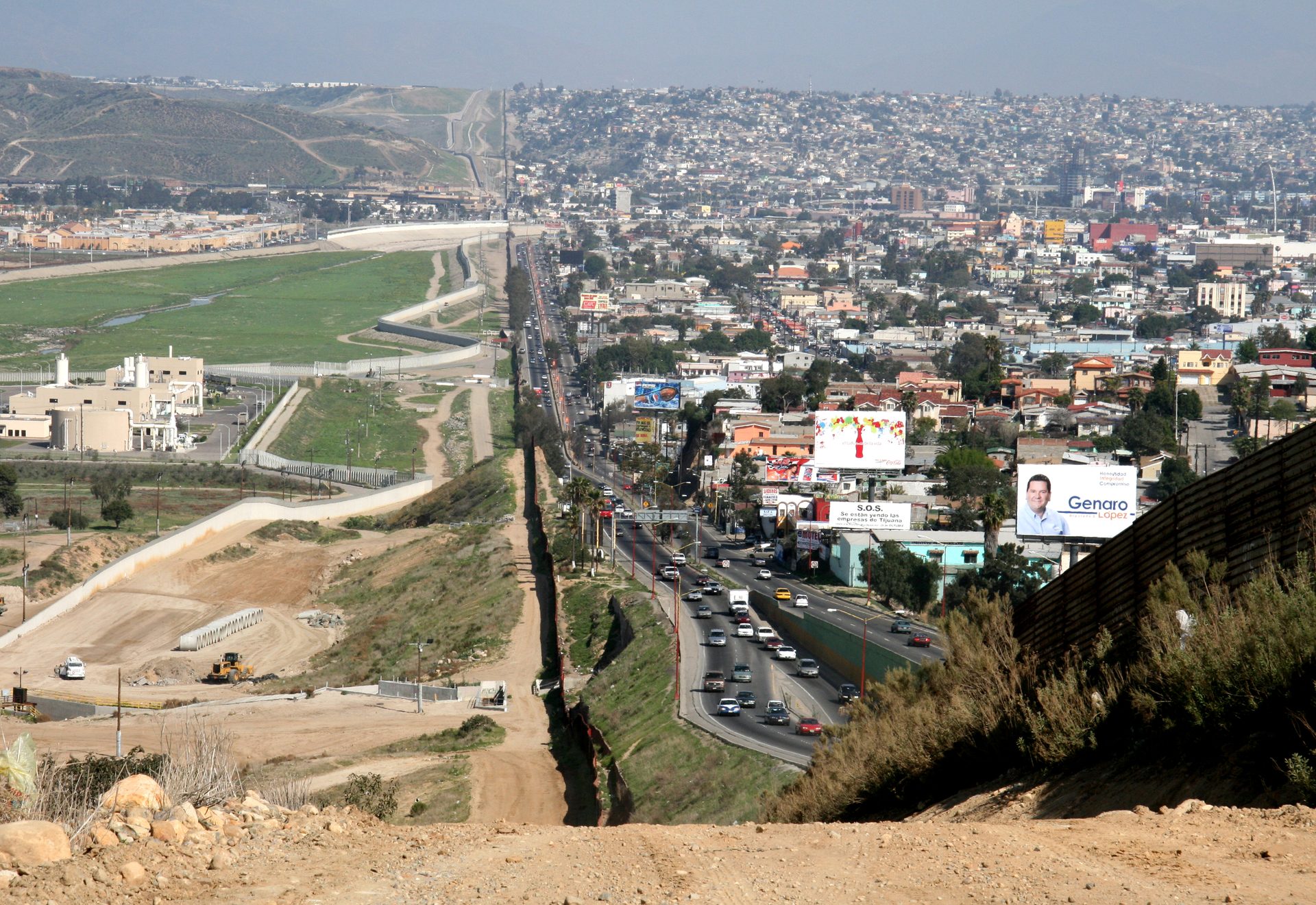 View along the US-Mexico border at Tijuana, illustrating cross-border fleet operations across different network shutdown timelines.