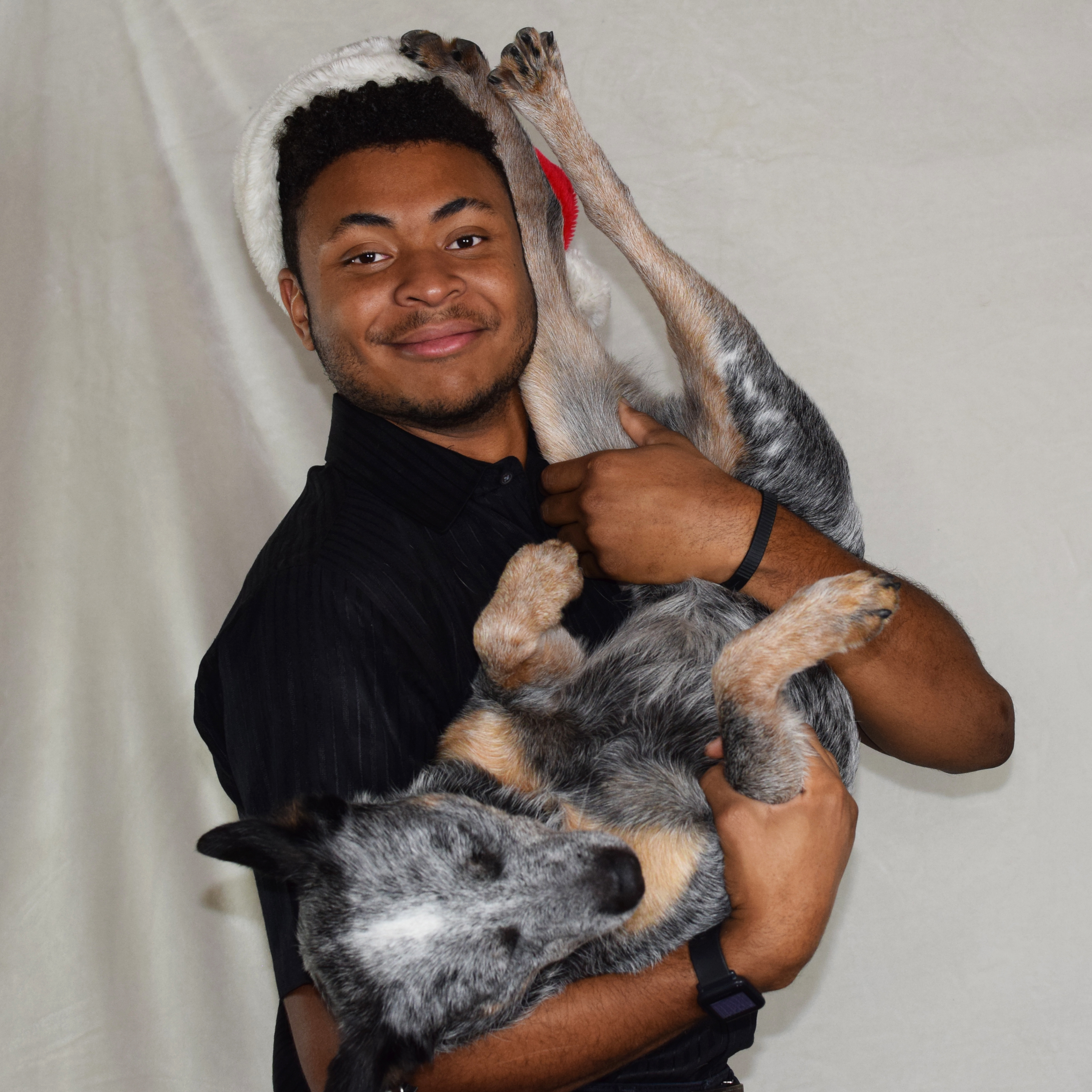 A photo of Cyrus Codner holding his dog