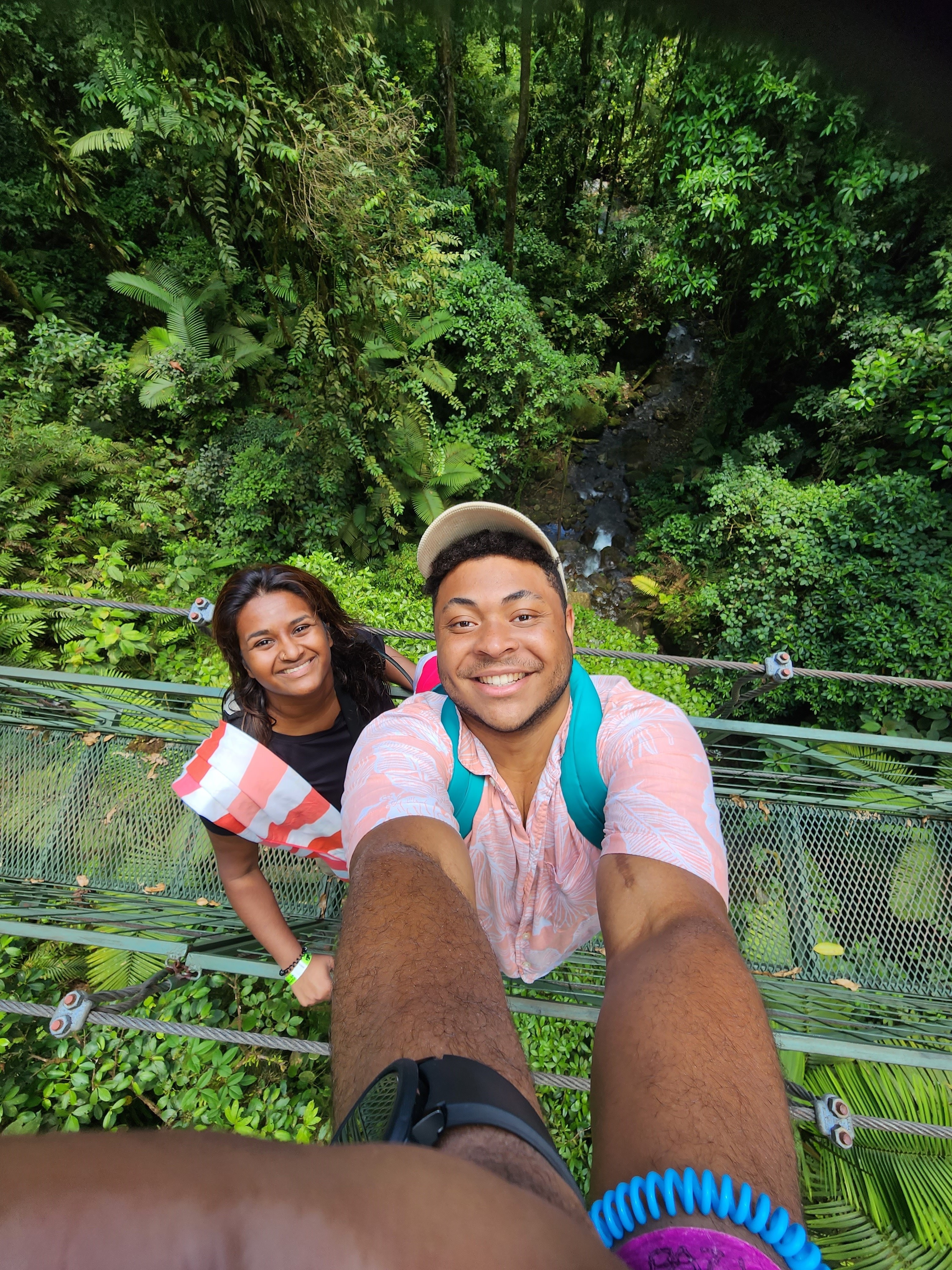 Cyrus Codner taking a selfie on a bridge with his girlfriend