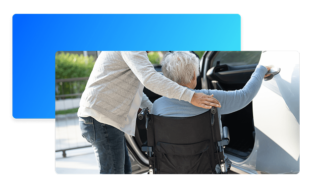 Driver assisting patient into wheelchair lift van