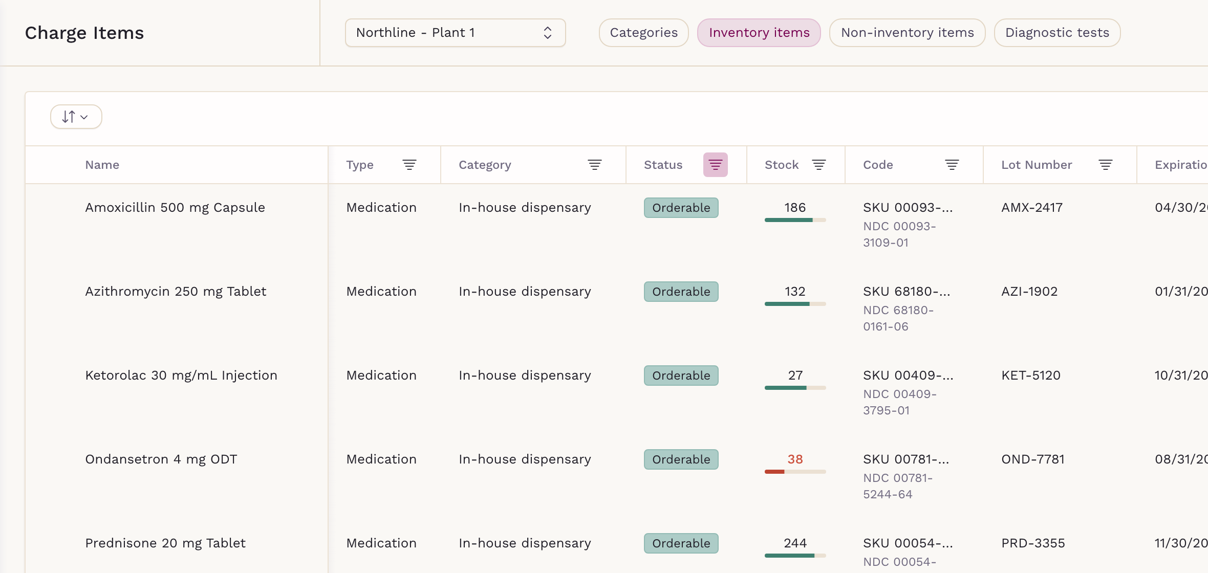 SigmaMD inventory list showing stock, lot numbers, expiry dates and a low-stock alert