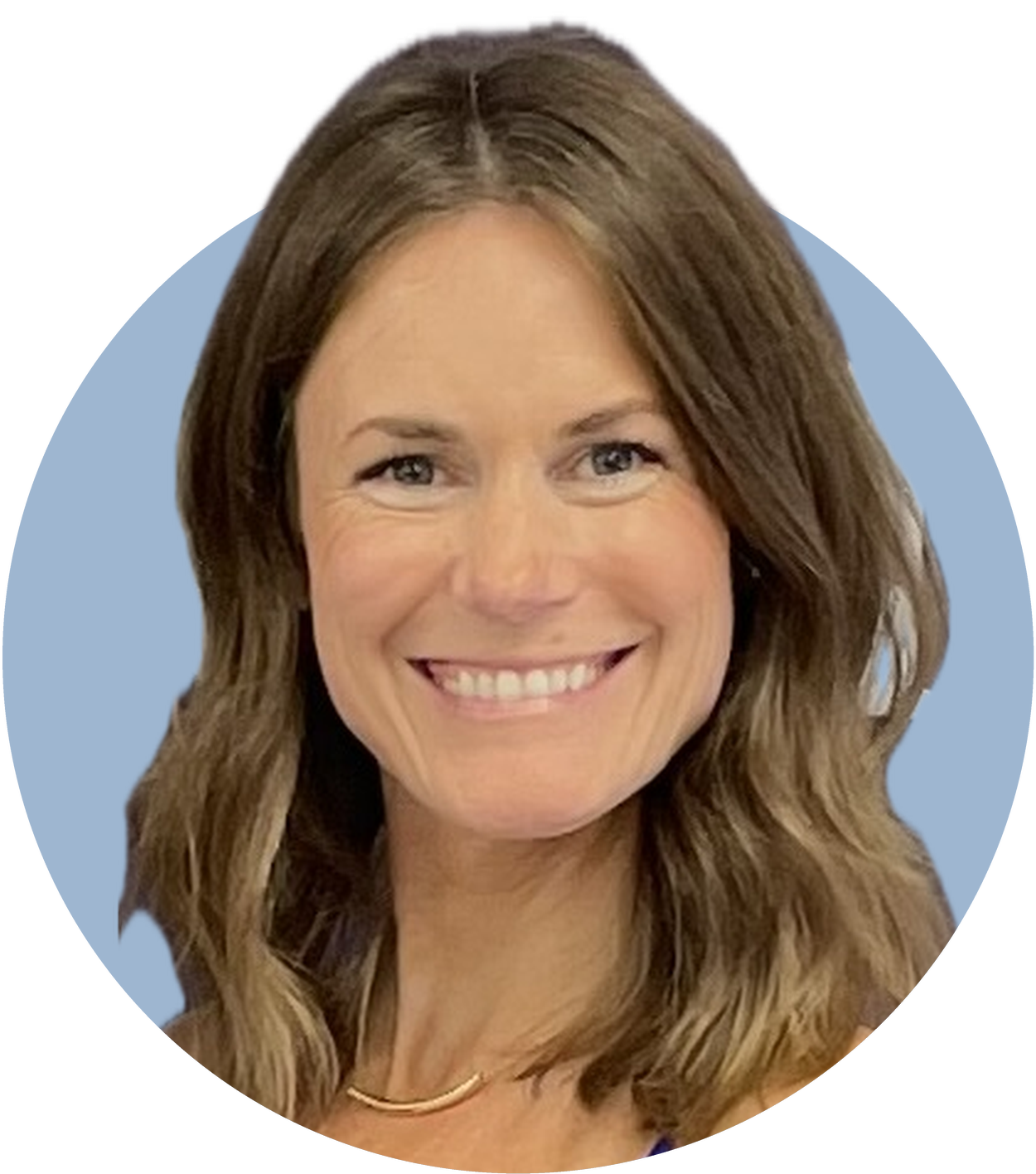 Picture of Tizzie. She has wavy brown hair and is smiling.