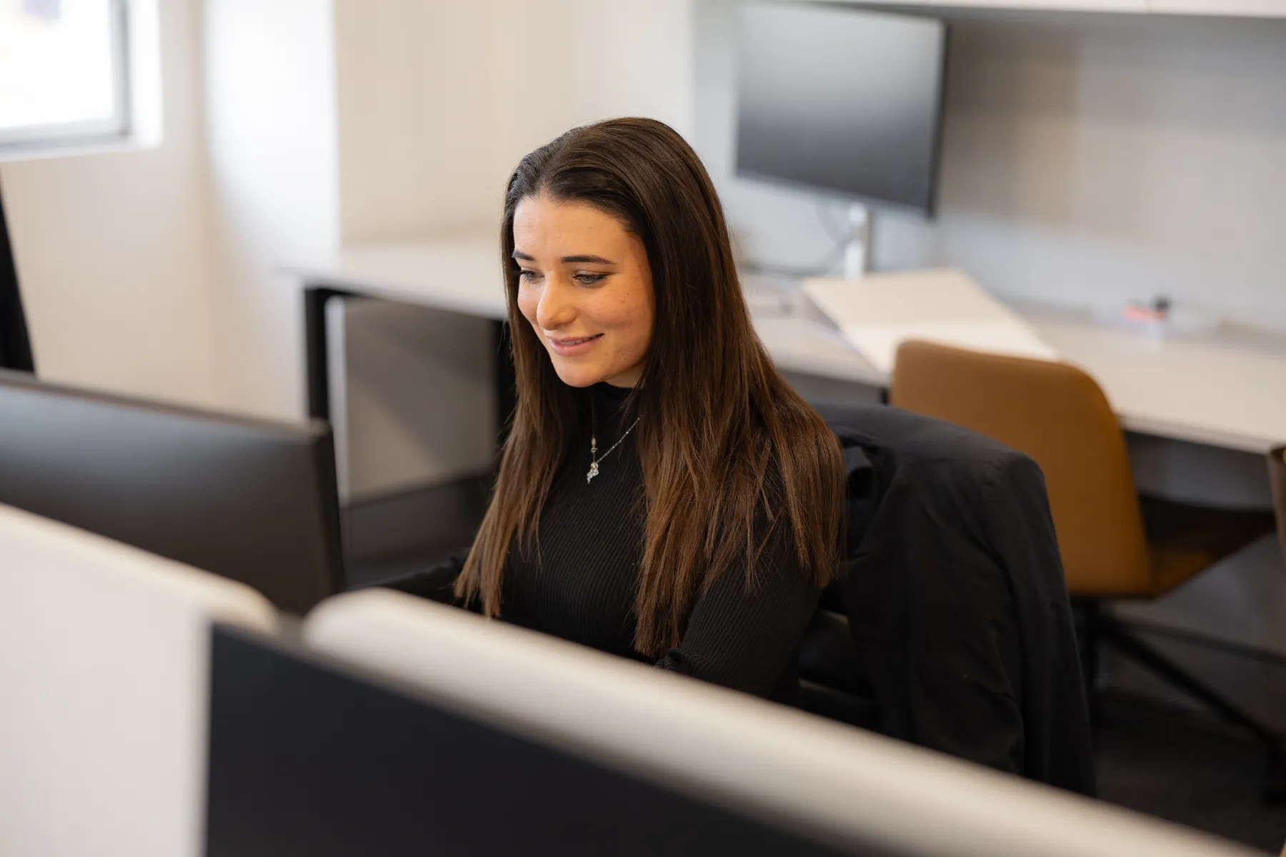 Lara Bartolone, paralegal at VRT Lawyers, working at her desk