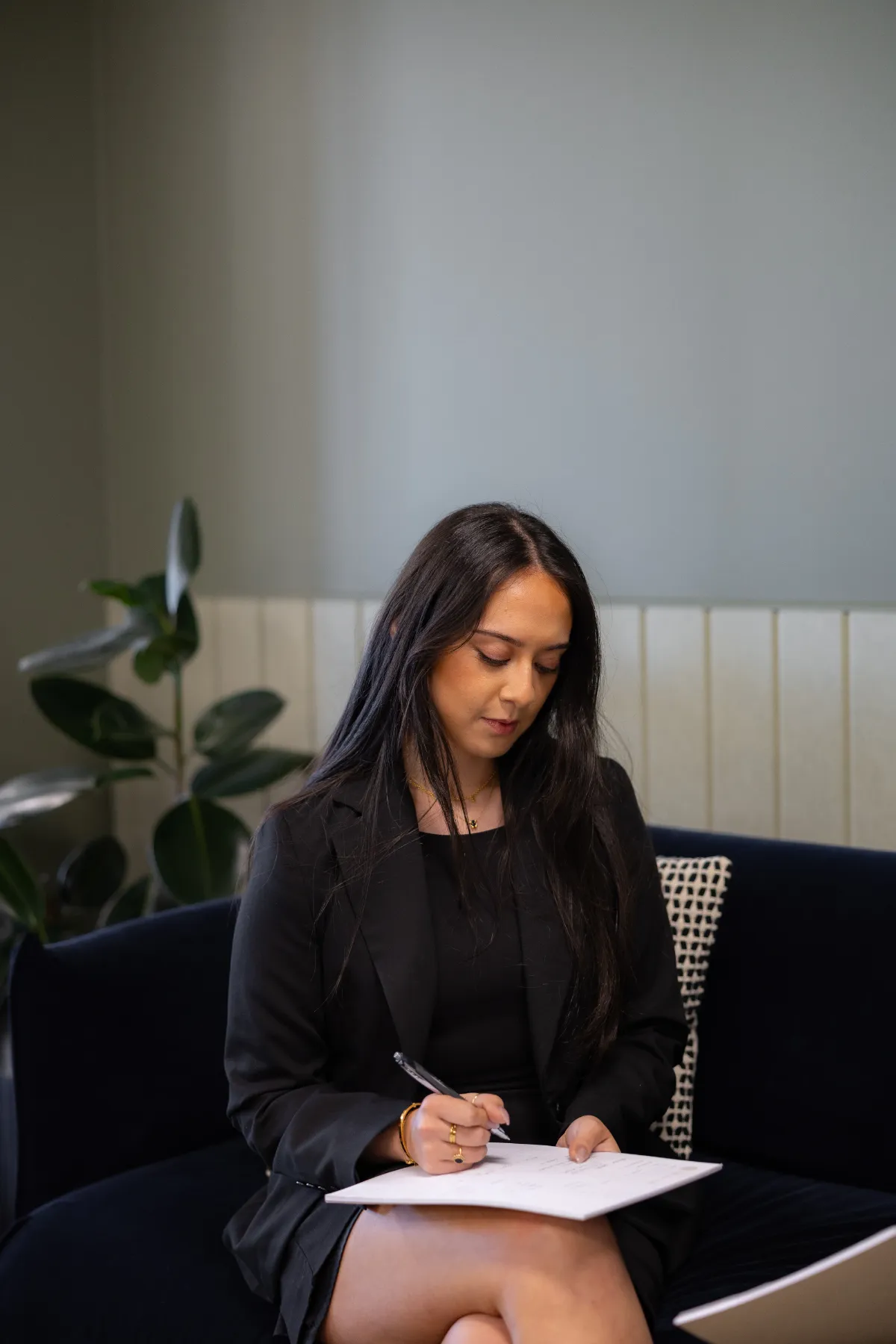 Genesis Burbano, solicitor at VRT Lawyers, taking notes