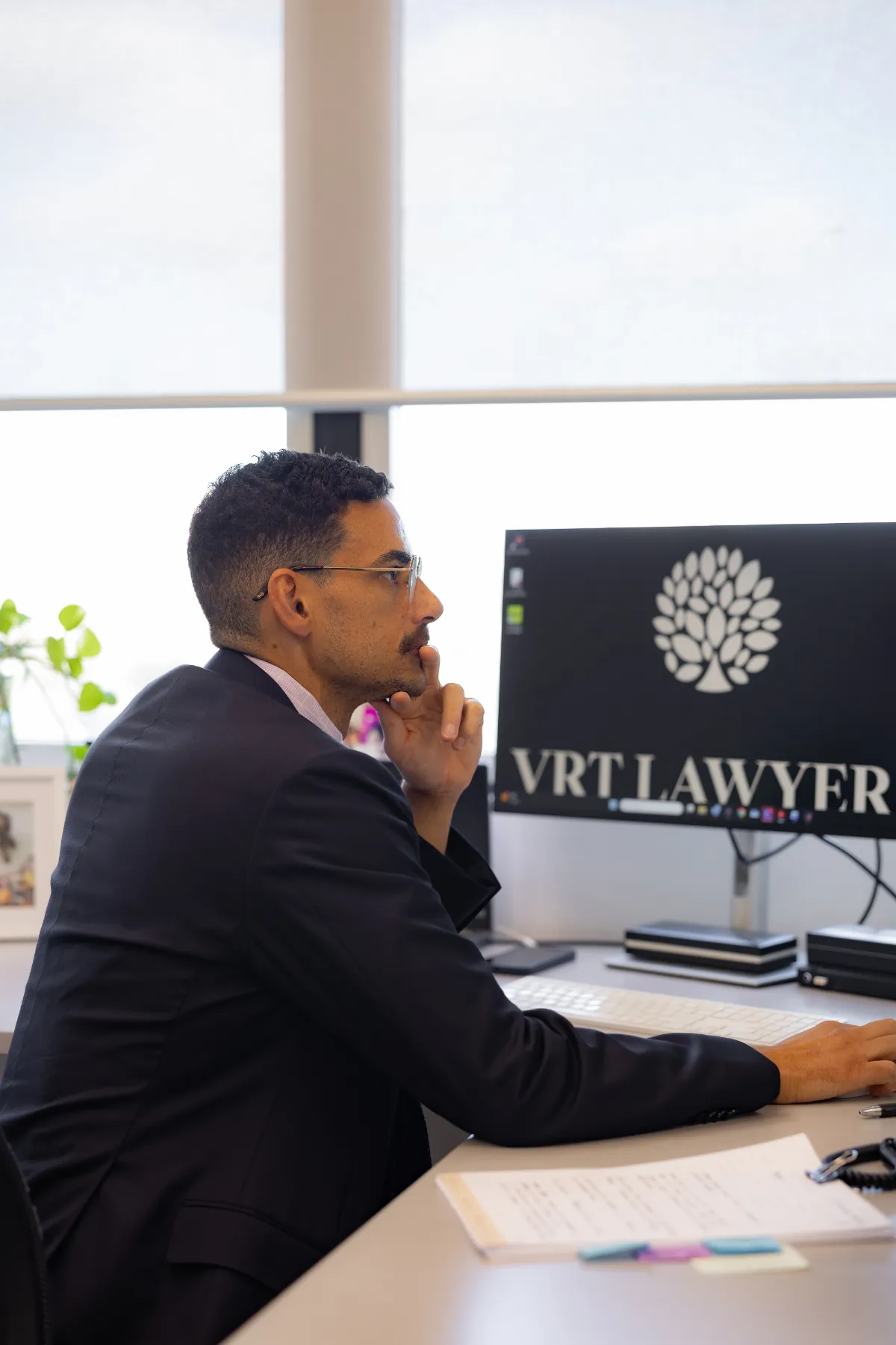 Tyson Beckman, associate at VRT Lawyers, working at his desk