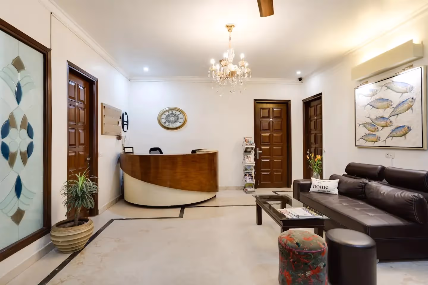 View of the reception area and the entrance at the Perch Arbor Suites hotel in Sushant Lok