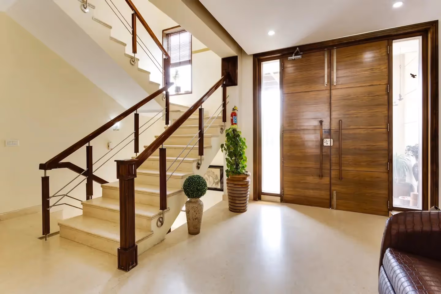 Entrance of the service apartment near cyber hub called Perch Sector 40 with a large entrance and lots of natural light flowing into the building