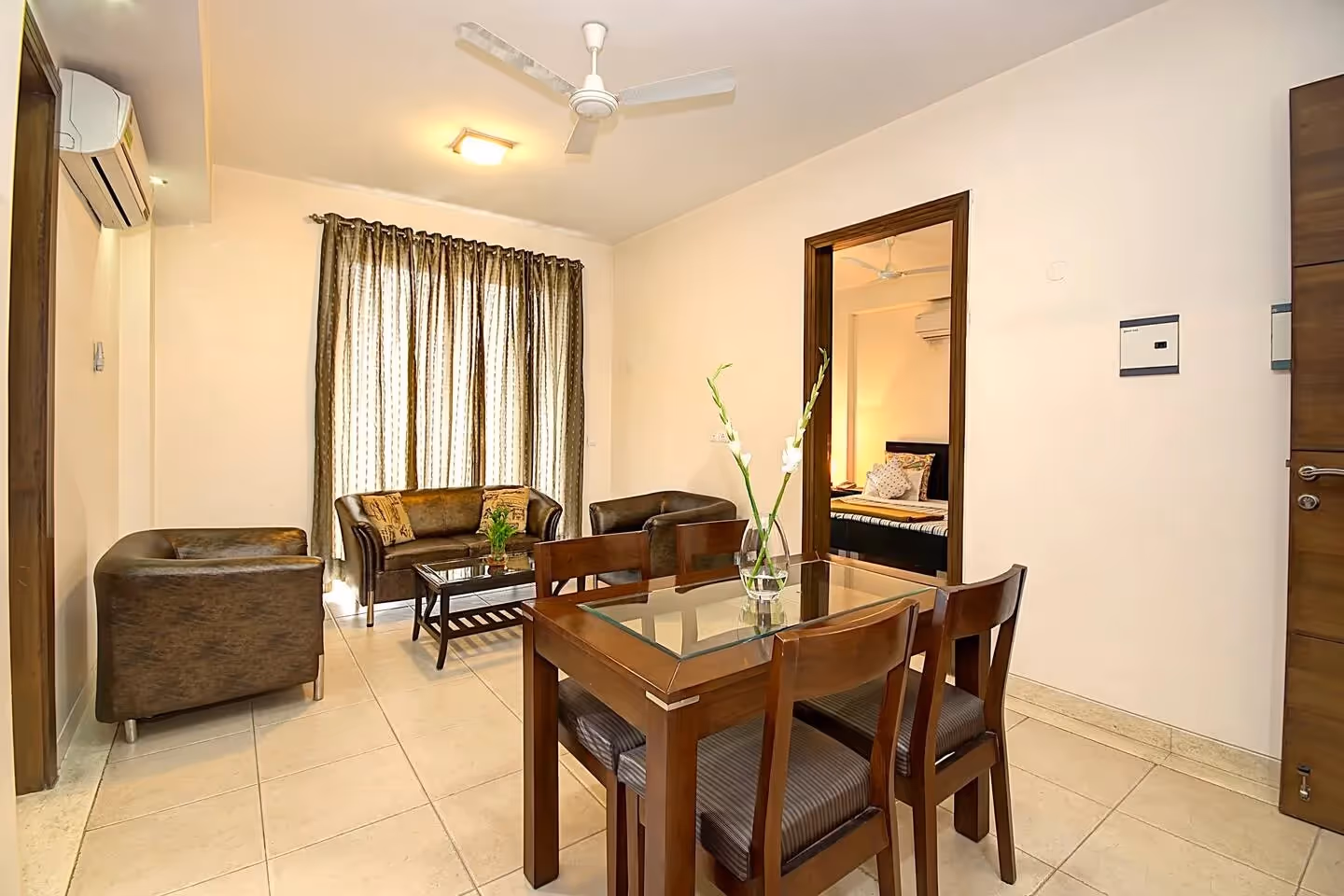 Cross section view of the serviced 2BHK apartment with the living area, kitchen and the bedroom as well. 