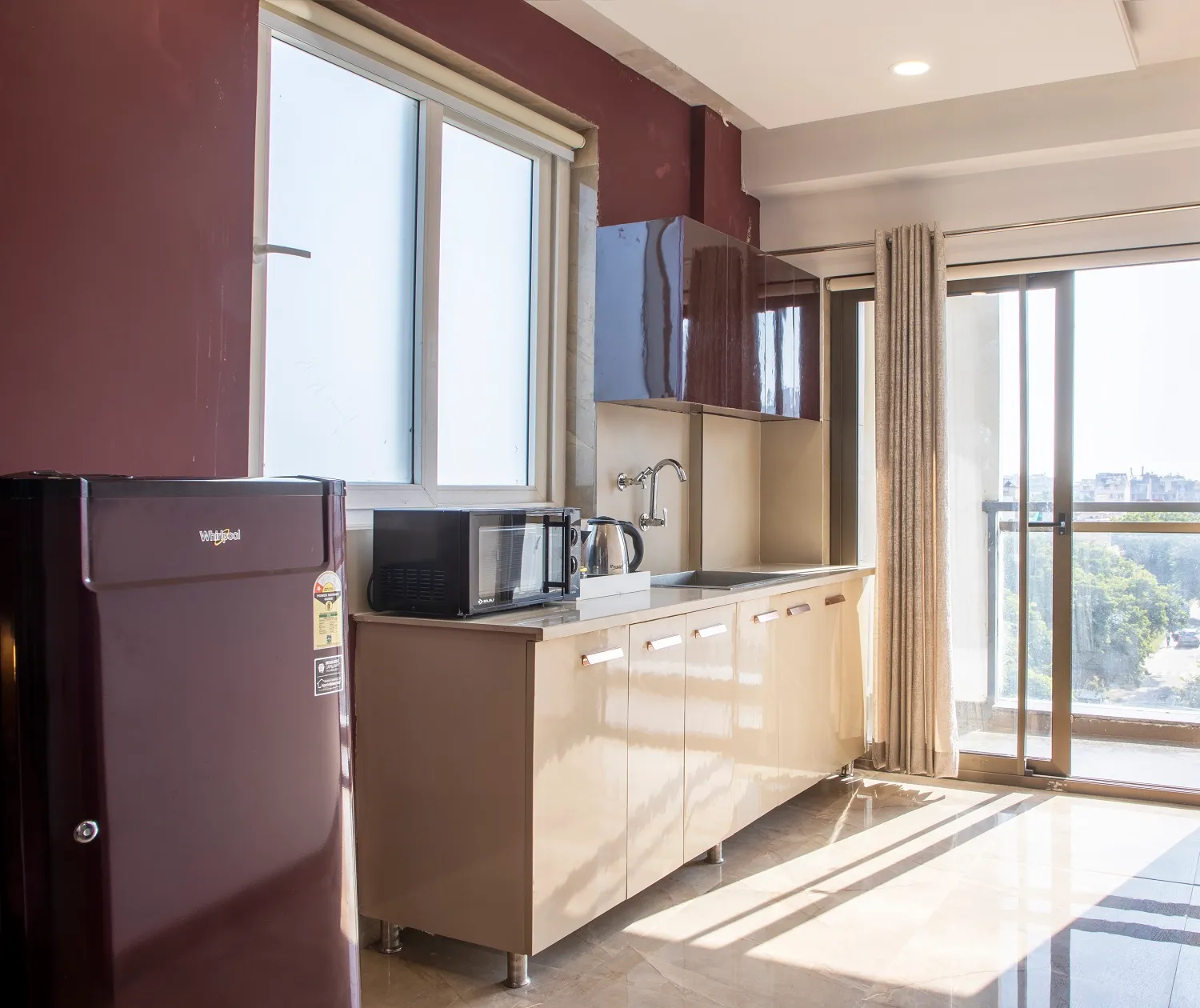 Kitchen in the serviced studio with all crocketry and appliances for cooking - Ideal for working corporates and located close to Cyber City in Gurugram