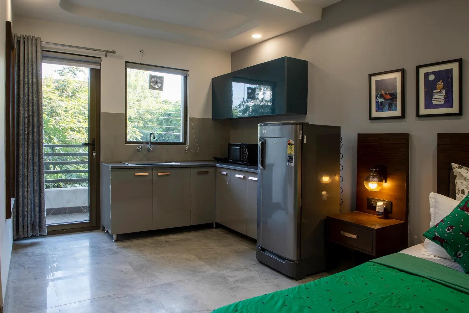 A view of the kitchen in the serviced studio near cyber city - These serviced studios are ideal for corporates, families & toursits. Daily housekeeping, free wifi, breakfast from Perch Service Apartments